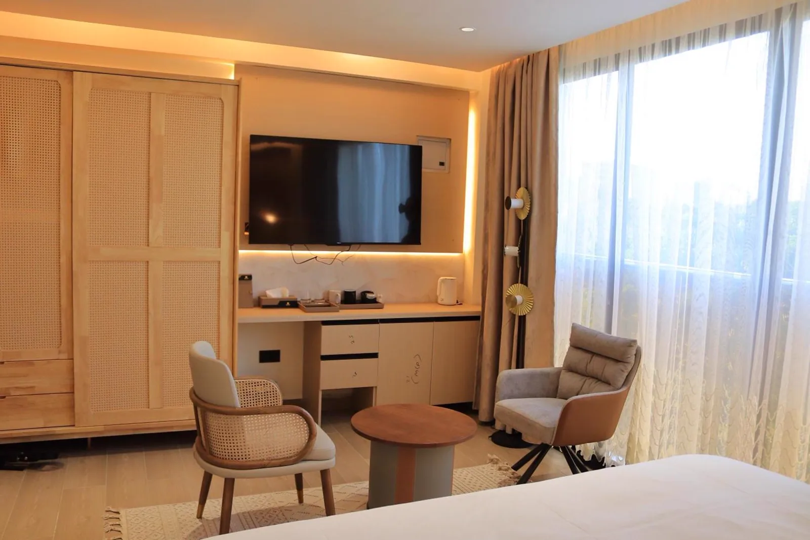 Arova Hotel guest room desk and media wall with cove lighting