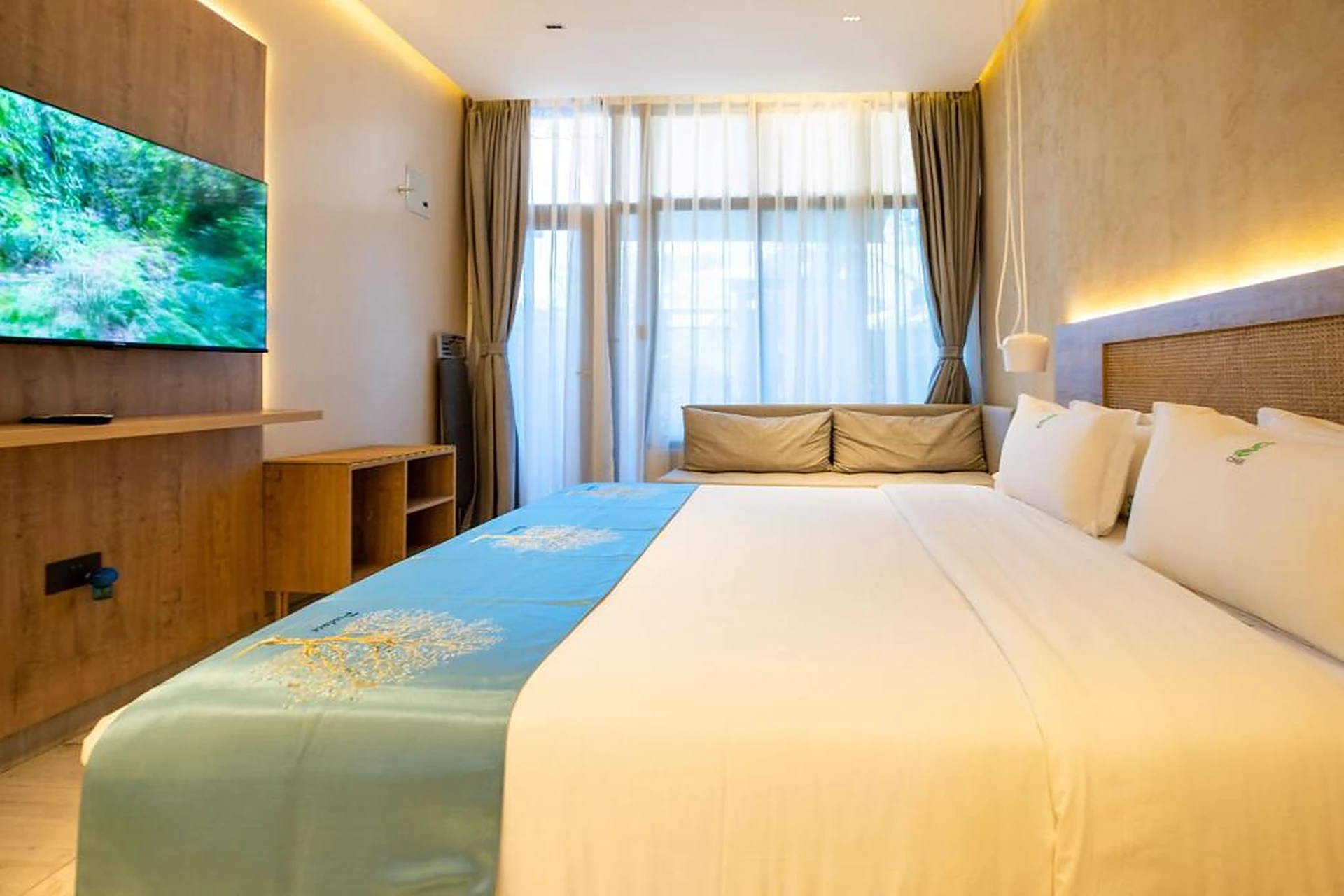 Gigiri Lion Villas suite with timber media wall and window seat