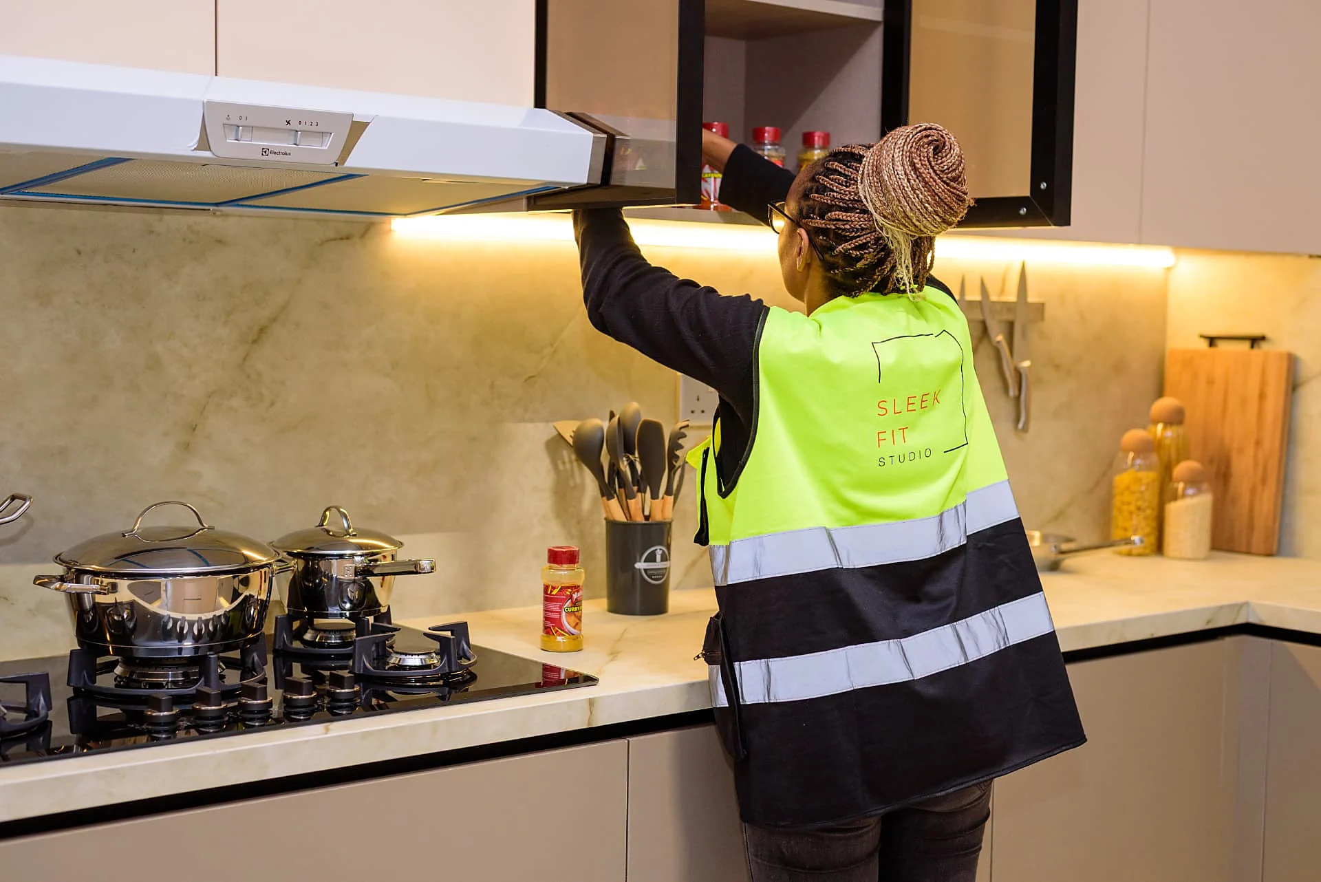 Sleek Fit Studio team member checking kitchen joinery at Krishna Bliss