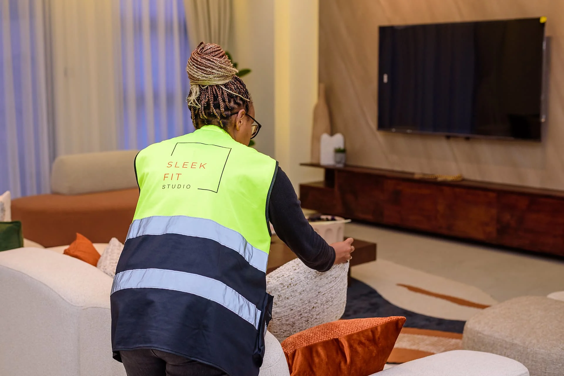 Sleek Fit Studio team member styling the Krishna Bliss living room
