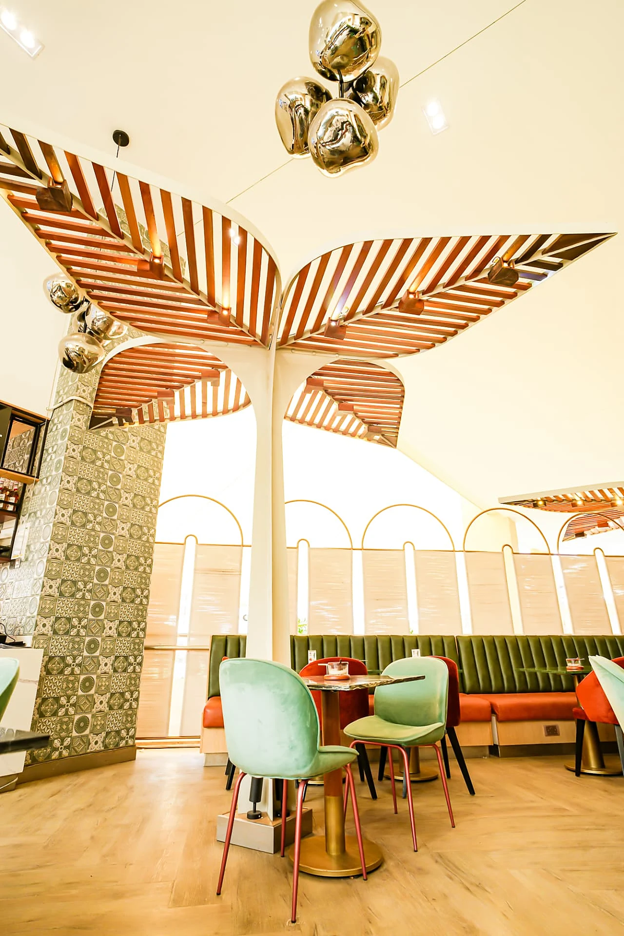 Timber slat canopy detail with brass pendant cluster