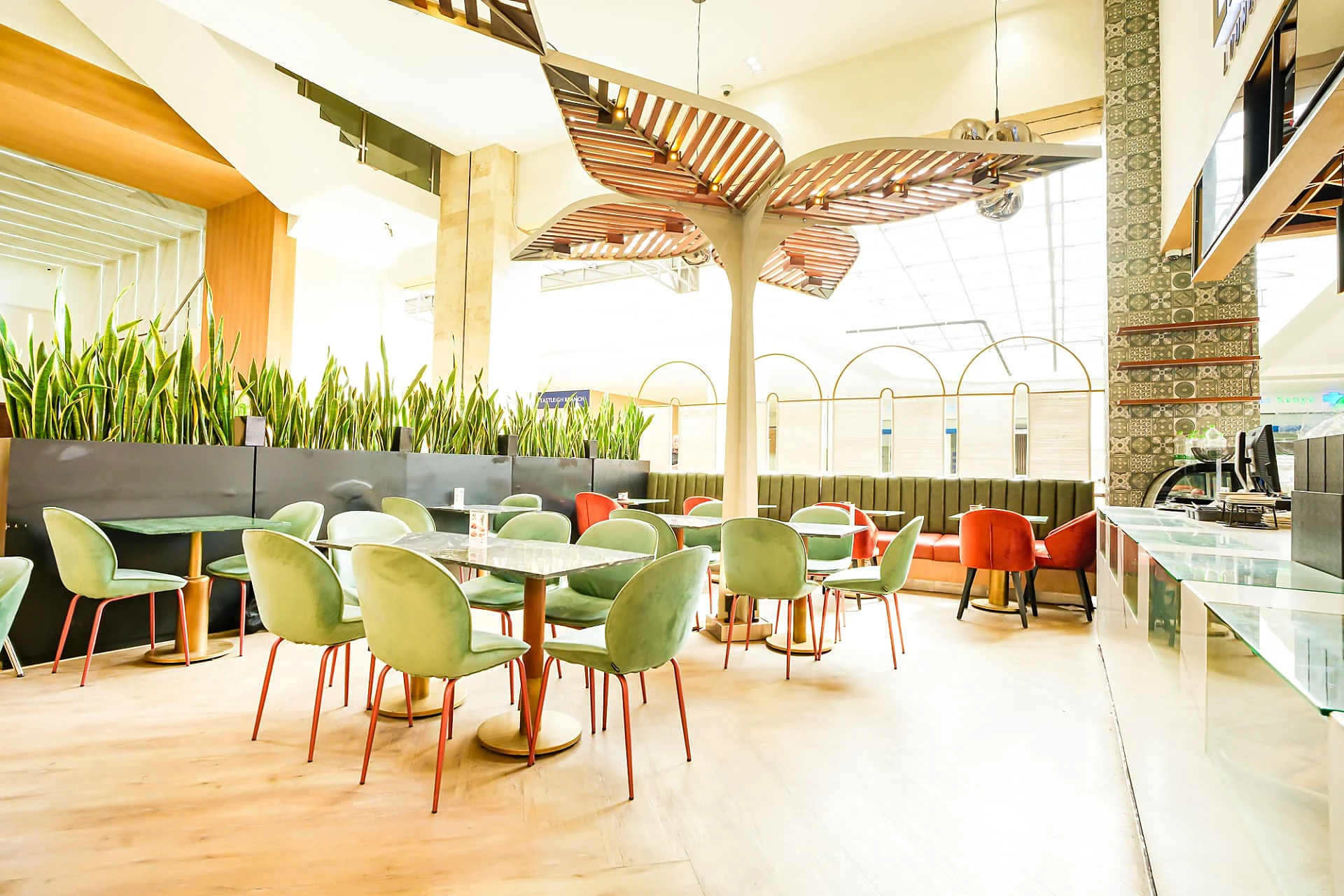 Latte Lounge dining area with planter screens
