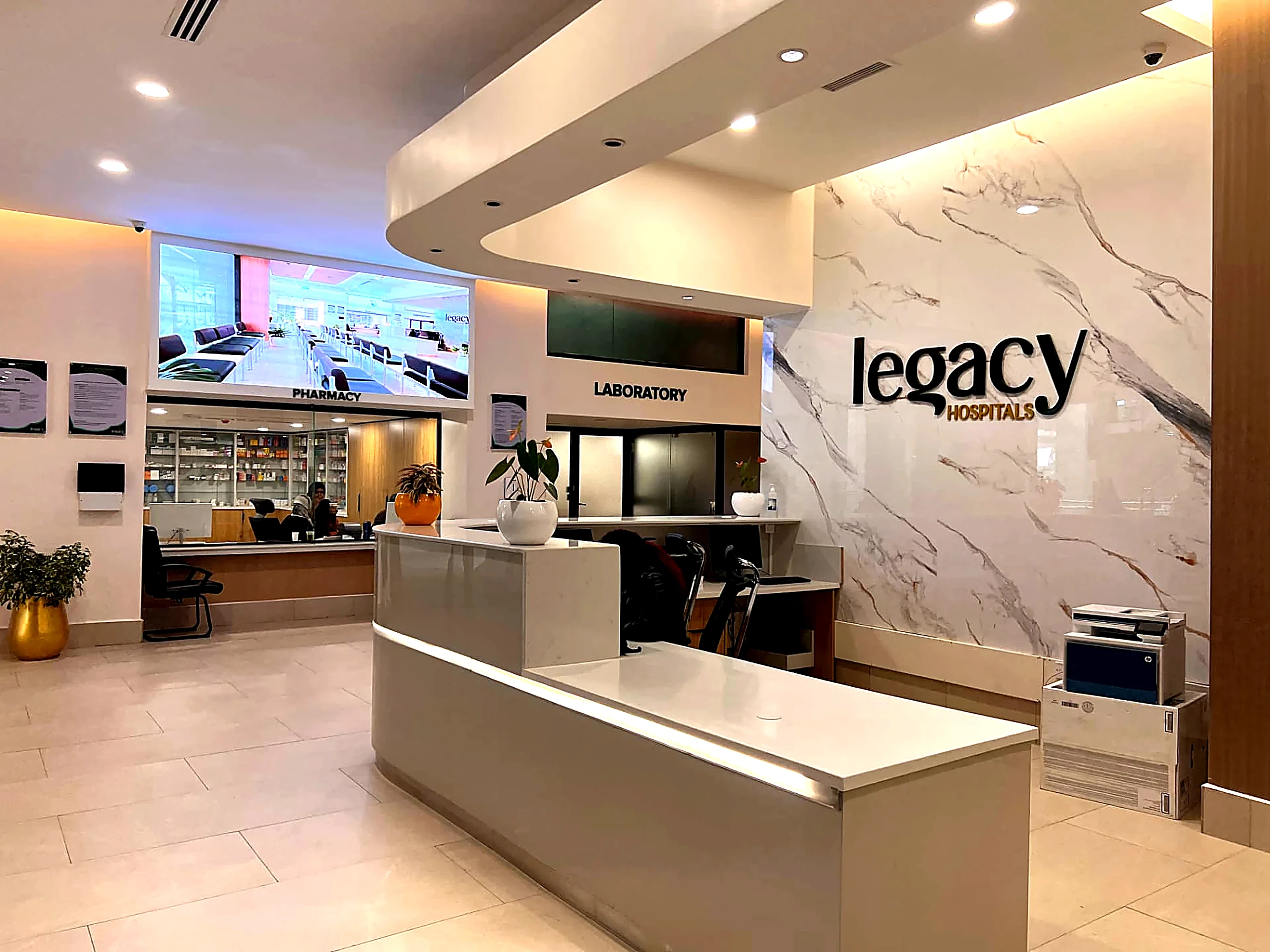 Legacy Hospitals reception counters with pharmacy and laboratory beyond