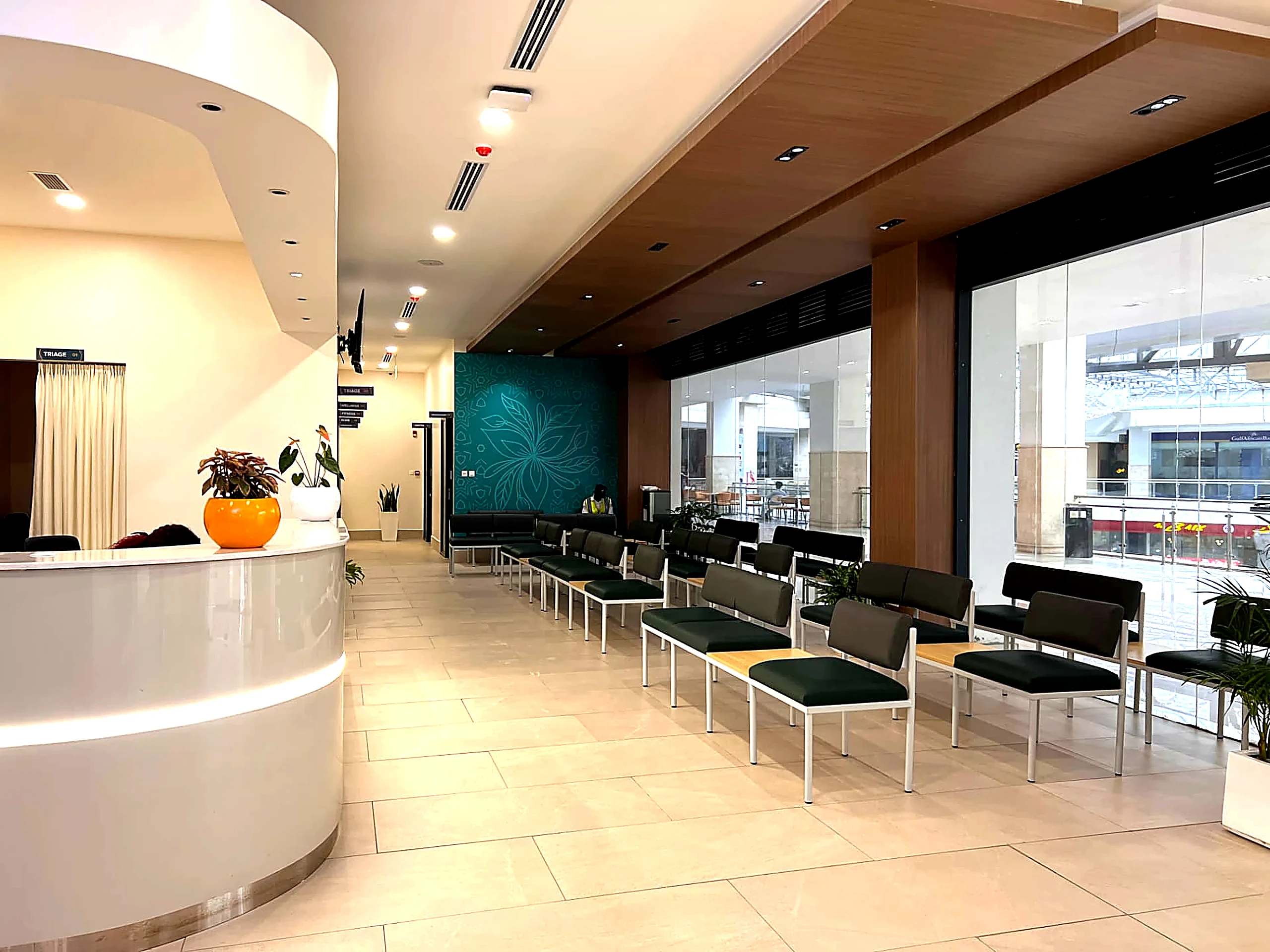 Legacy Hospitals patient waiting area with glazed frontage and planting
