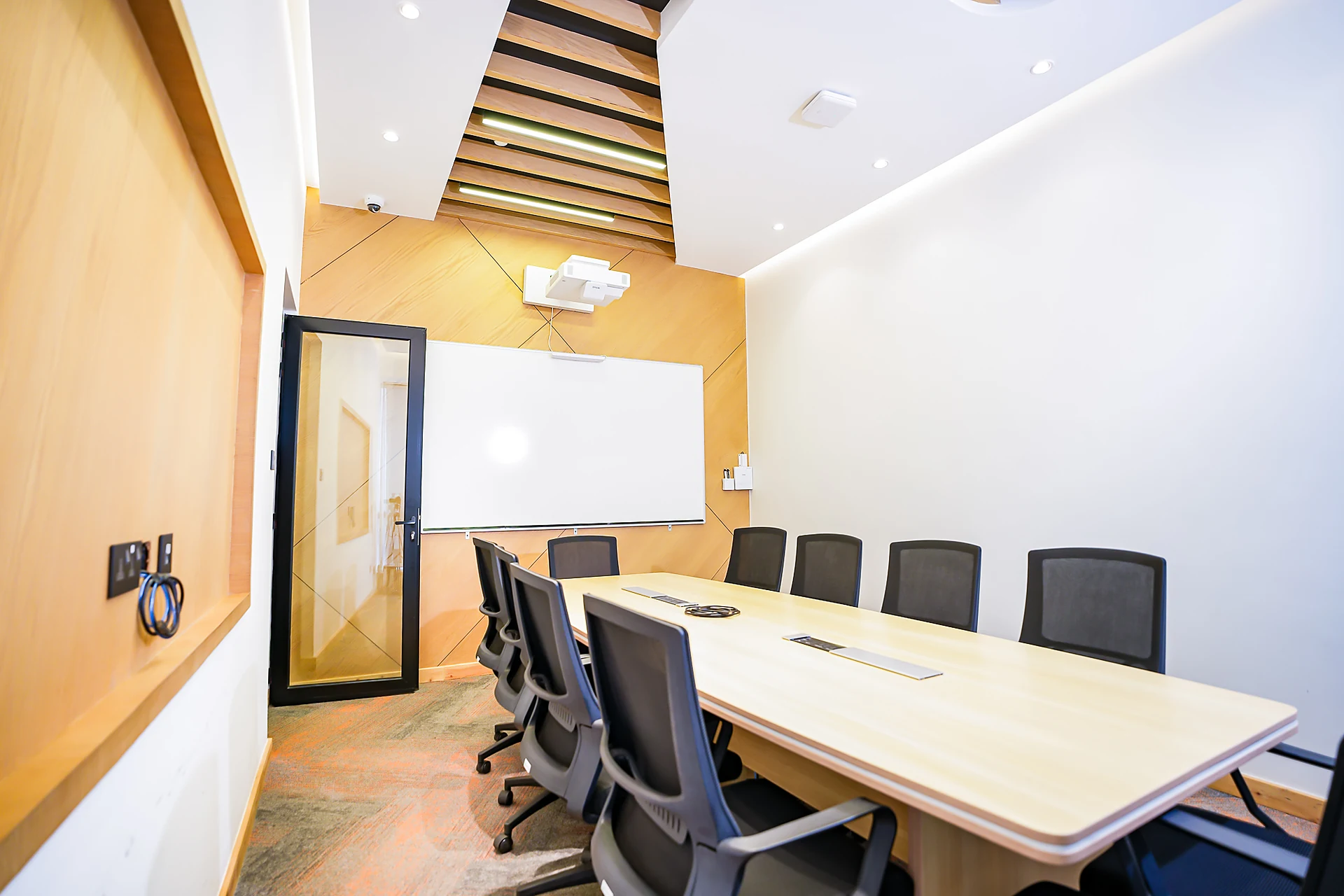 Mintel Solutions meeting room with timber panelling and whiteboard