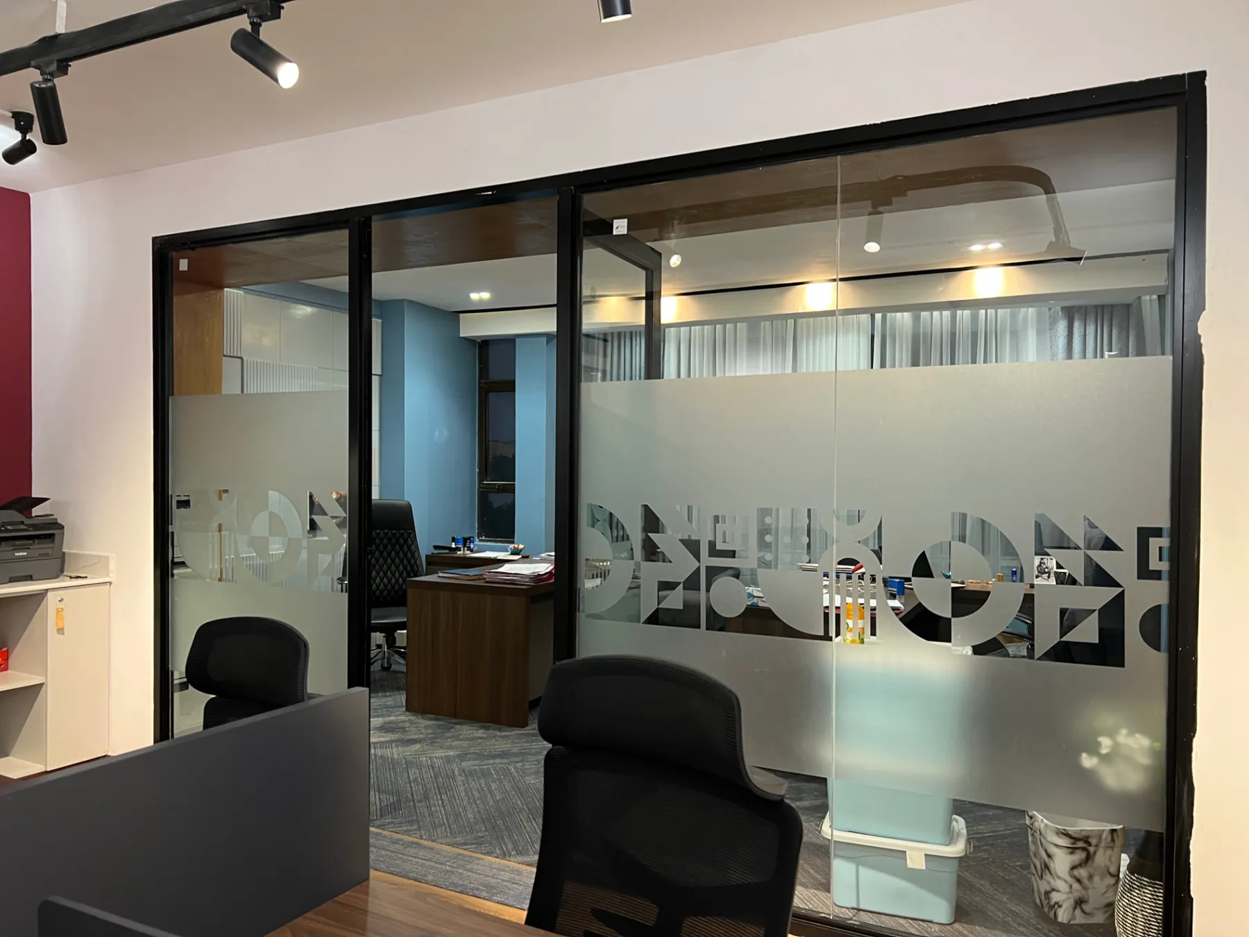 Partner office behind patterned frosted glazing
