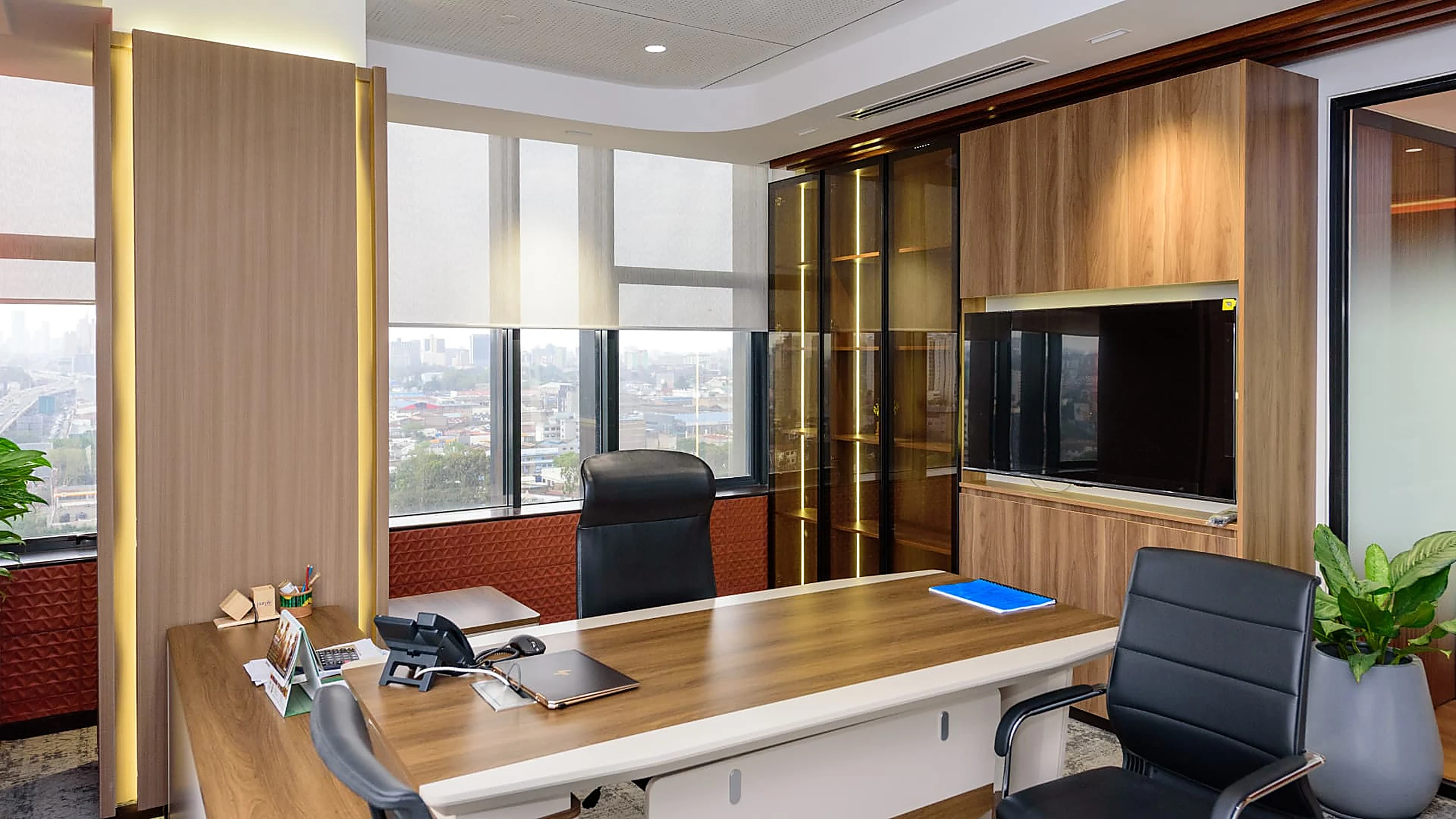 Rworld executive office with timber joinery, display cabinet and city view